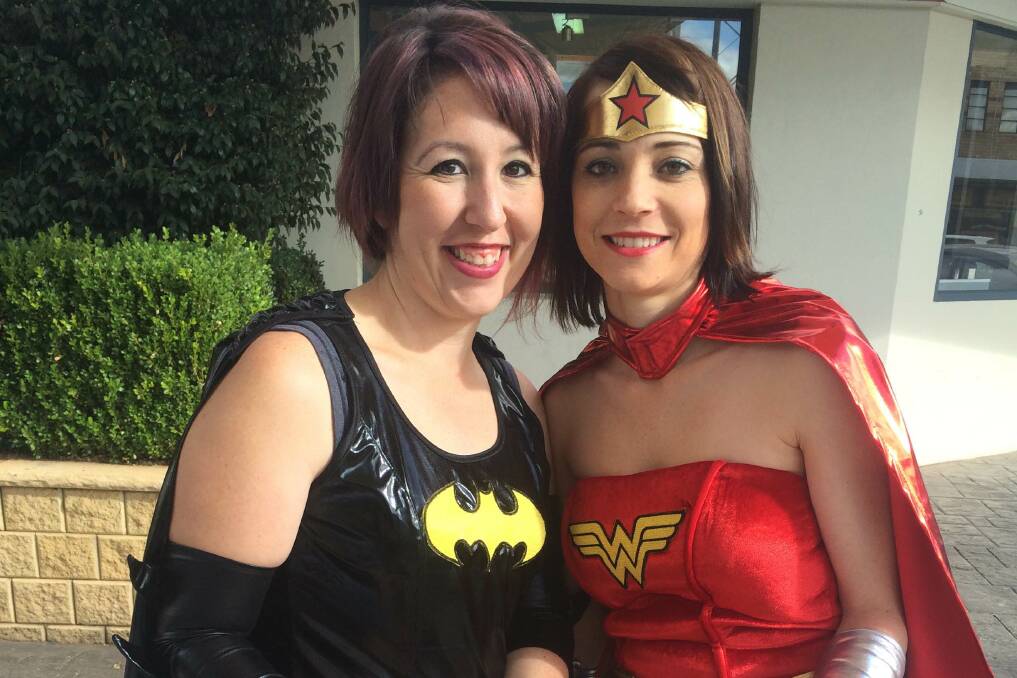 GENEROUS SPIRIT: Olivia Symes and Middy Nardi dress as superheroes to raise funds for HeartKids NSW on Friday. Picture: Monique Patterson