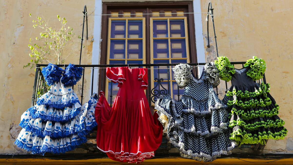 You’ll love the colours… traditional flamenco dresses at a house in Andalusia.