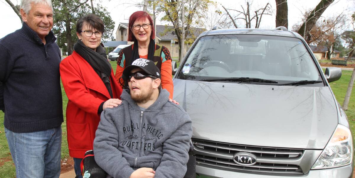 NEW WHEELS: John Martin, Fiona Stevens, Dean Walsh and Sue Gavel stand with the community funded 'Dean's Wheels' a special vehicle to help Dean attend medical appointments as well as other activities like visits to the river.