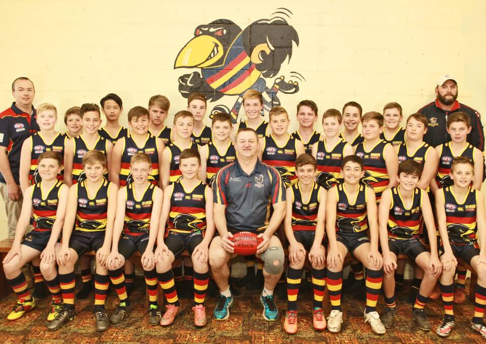 The Crows under 13s footballers and support staff.