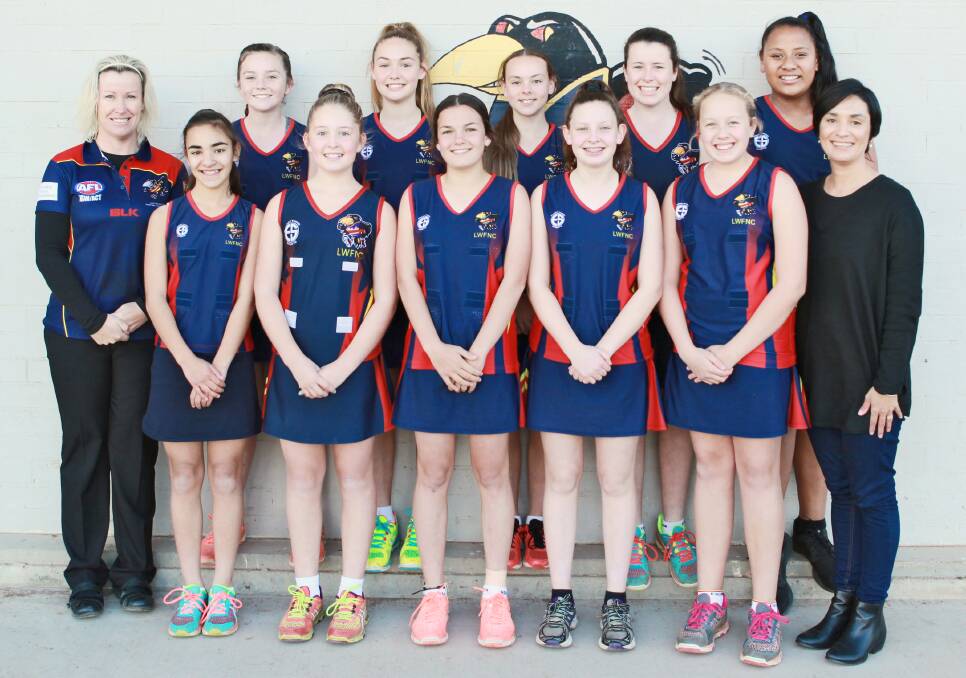 The under 13s Crows netballers and coaching staff.
