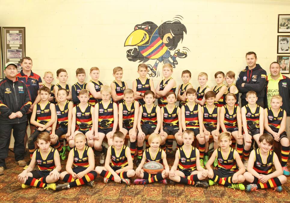 The Crows under 11s players, coaches and support staff.