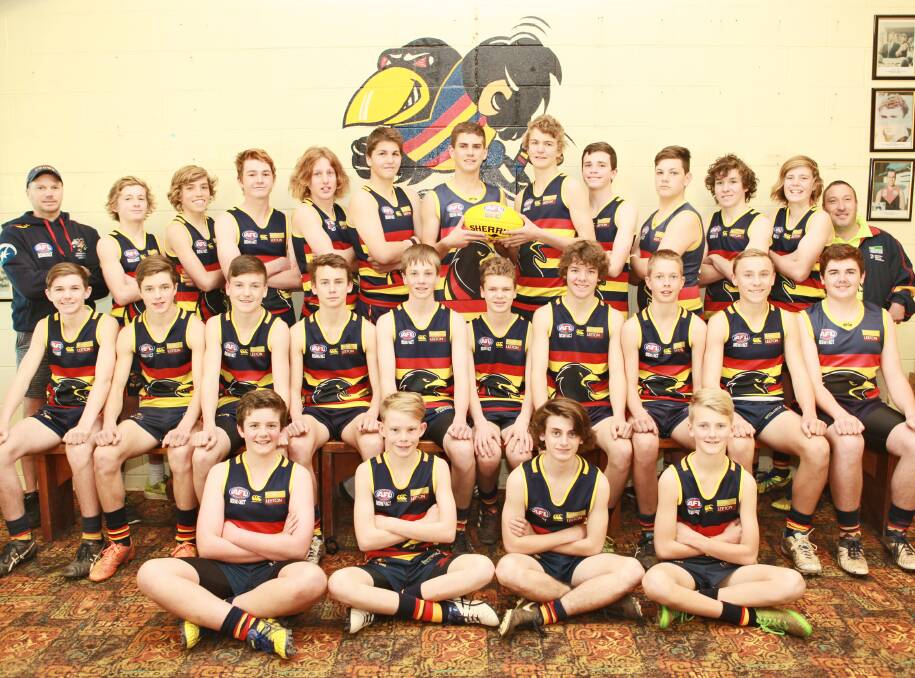 The Crows under 15s with coaches and support staff.