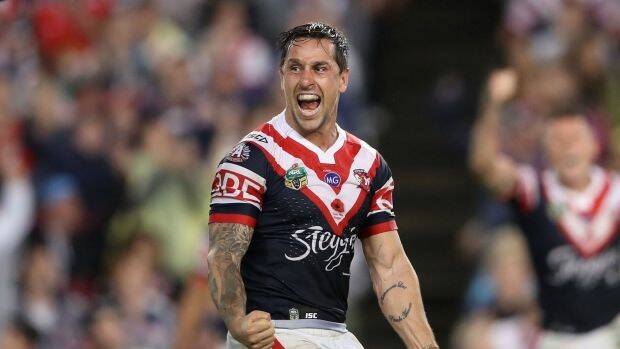 Mitchell Pearce celebrates kicking a field goal to claim golden point victory for the Roosters over the St George Illawarra Dragons. Photo: Mark Kolbe, Getty Images