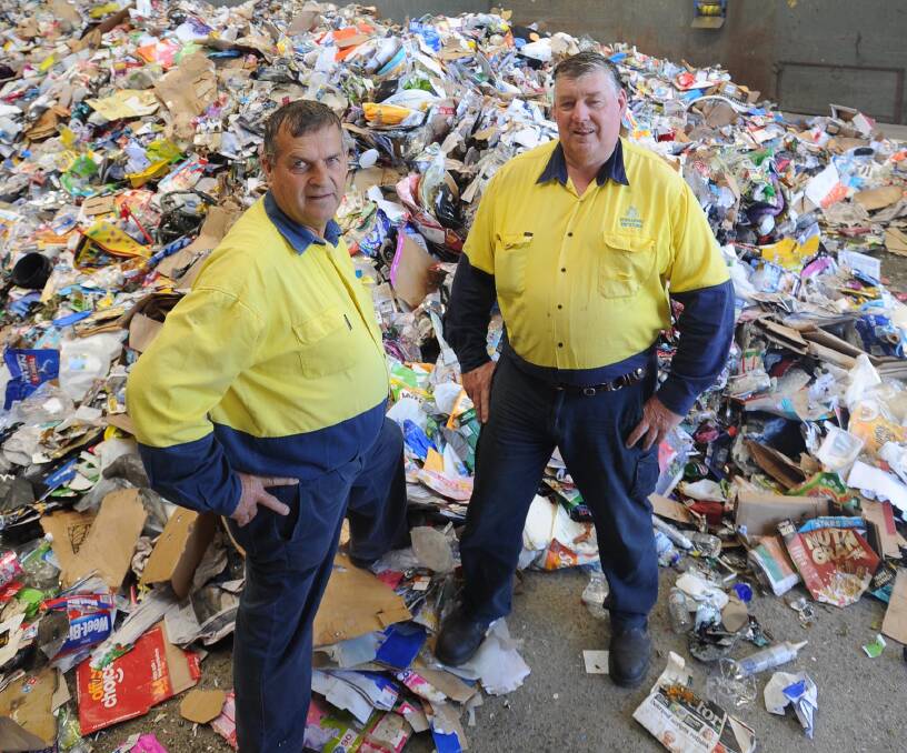 NEW LIFE: Neville McDonell and John Condron from Kurrajong Waratah recycling eye off some big changes at the facility.