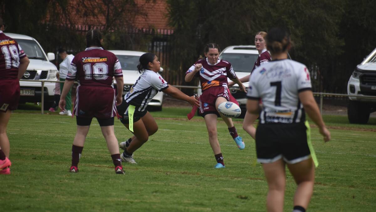Brittany Dolan looks to get a kick downfield during Yanco-Wamoon's League Tag season opener against Black and Whites. Picture by Liam Warren