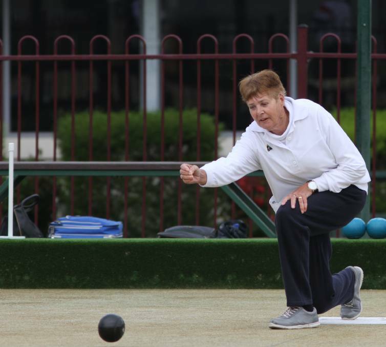 STYLISH: The adverse bowling conditions were no problem for Diane Colyer, managing a resting toucher during play.