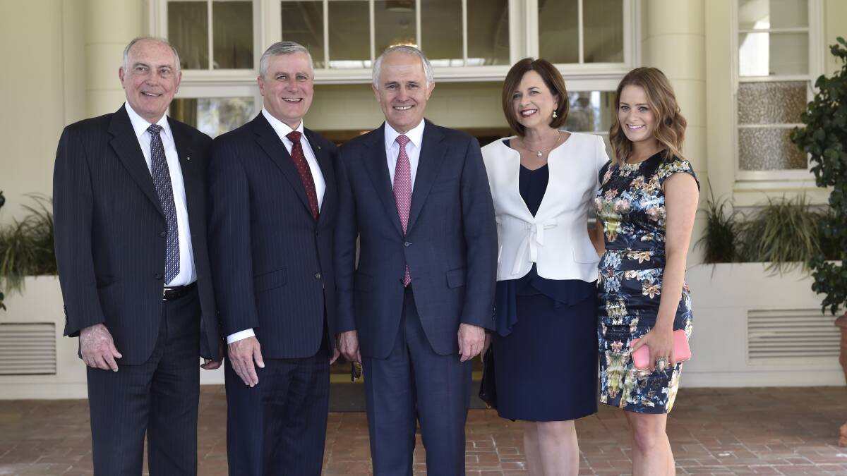 Deputy Prime Minister Warren Truss, new Assistant Minister to the Deputy Prime Minister Michael McCormack, Prime Minister Malcolm Turnbull, Catherine McCormack and Georgina McCormack at the swearing in ceremony on Monday.