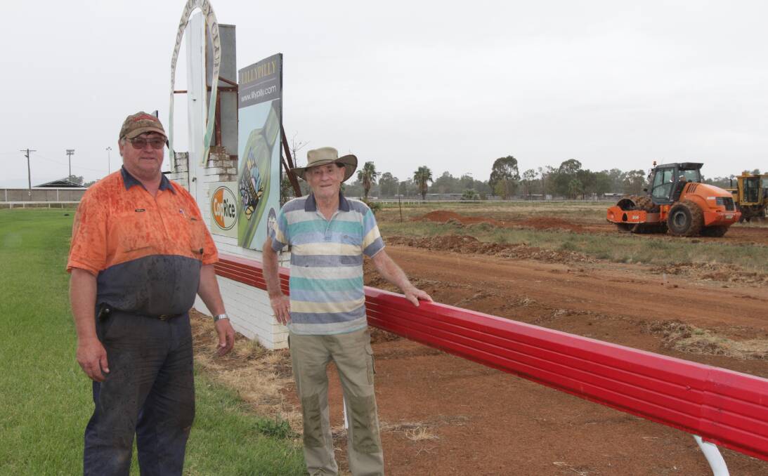 EFFORT: Work is underway to create an area for a tractor pull at the Leeton Jockey Club ahead of the Riverina Vintage Machinery Club rally. Club president Tim Langley (left) and publicity officer Laurie Withers survey the progress.