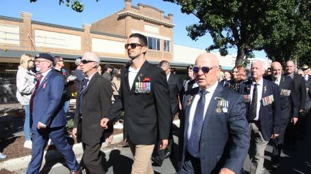 Leeton shire veterans make their way down Pine Avenue during the main march and commemoration service during Anzac Day. Picture by Talia Pattison