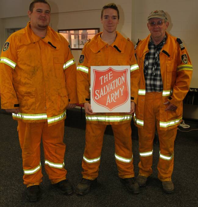 TOP JOB: Ryan Weston, Mathew Murphy and Ian Thompson from the Yanco-Wamoon Rural Fire Service prepare for last year's Red Shield Appeal. 