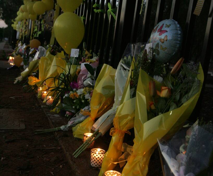 TRIBUTE: Following Stephanie Scott's death the gates at Leeton High School were covered in all things yellow to honour her memory. 