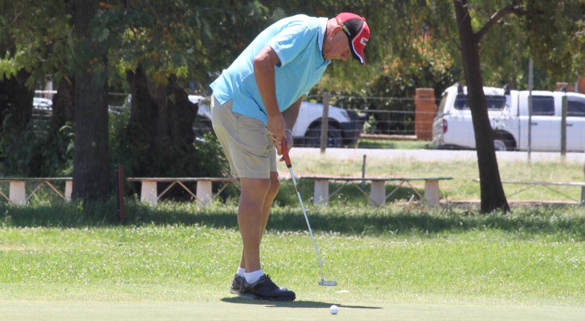 EYE ON THE PRIZE: Kevin Hollis concentrates on his putt at the Leeton golf course last weekend.