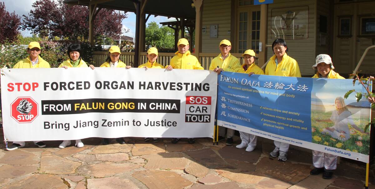 SHOW SUPPORT: Falun Gong activists paid a visit to Leeton this week to spread awareness of forced organ harvesting in China. Photo: Talia Pattison  