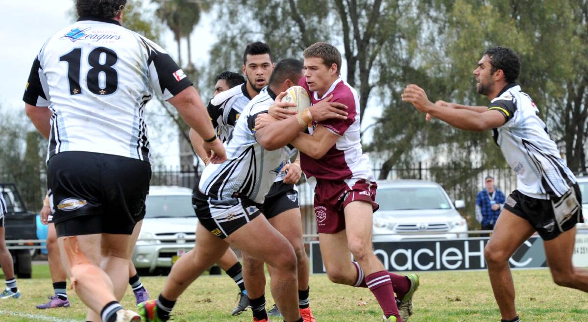 WRAPPED UP: Yanco-Wamoon captain Glenn Dumbrell runs into the Griffith Black and Whites defence last weekend.