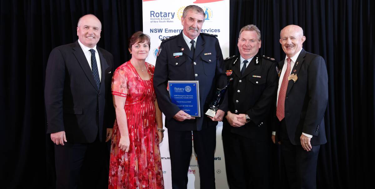 HONOUR: Emergency Services Minister David Elliott, partner Helen Newman, Deputy Commissioner Jim Hamilton and Rotary's Stephen Humphreys congratulate Leeton Fire and Rescue NSW Captain Graham Parks (middle). 