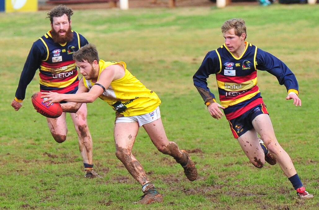 UNDER PRESSURE: Coolamon's Zachary Robinson is chased down by Leeton-Whitton's Brady Dunn and Danyan Evans.


