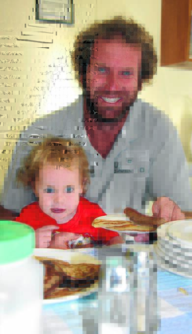 DELICIOUS: Matt Robertson and son James, 2, prepare to tuck into an Australia Day feast at the Murrami CWA breakfast where a good crowd turned out on the day.