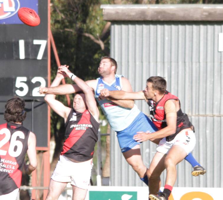 FLY: Barellan's Ben Evans goes up to defend the ball during an earlier game this year against Marrar at Barellan Sportsground. Photo: Ron Arel 