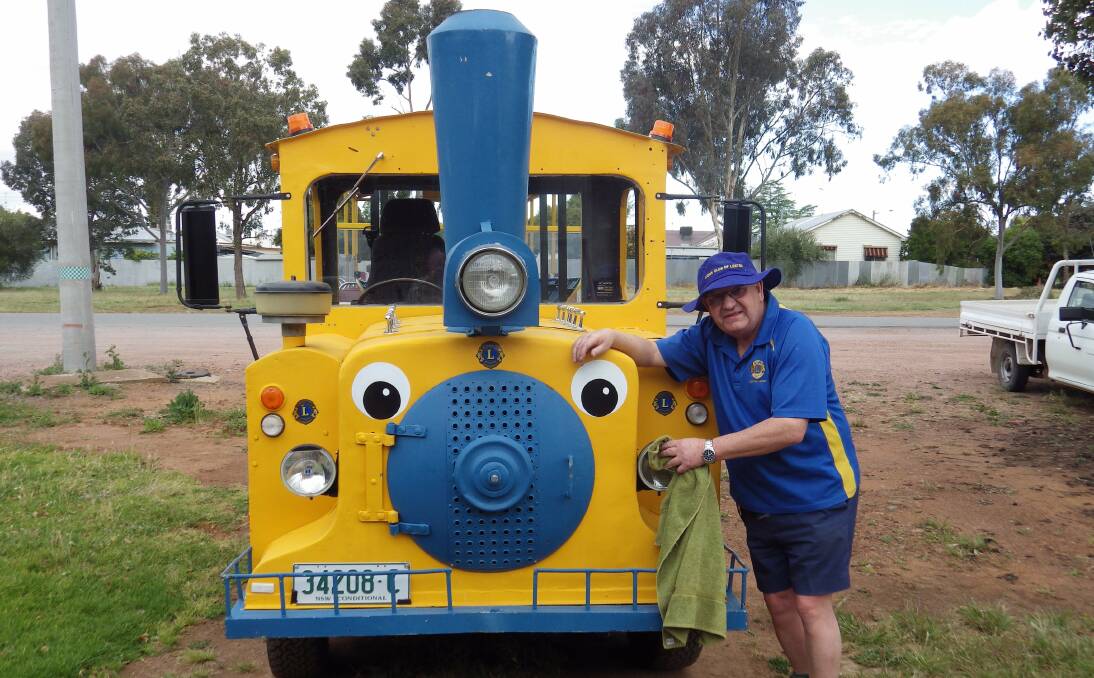 RARING TO GO: Leeton Lions Club president Brian Collins gives the final inspection and clean in preparation for the Christmas light tours.
