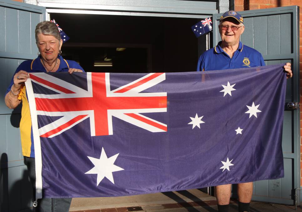 PROUD: Yanco Lions Club members Gae and Allan Stott show off their Australian spirit at the breakfast on Thursday morning. Photo: Talia Pattison