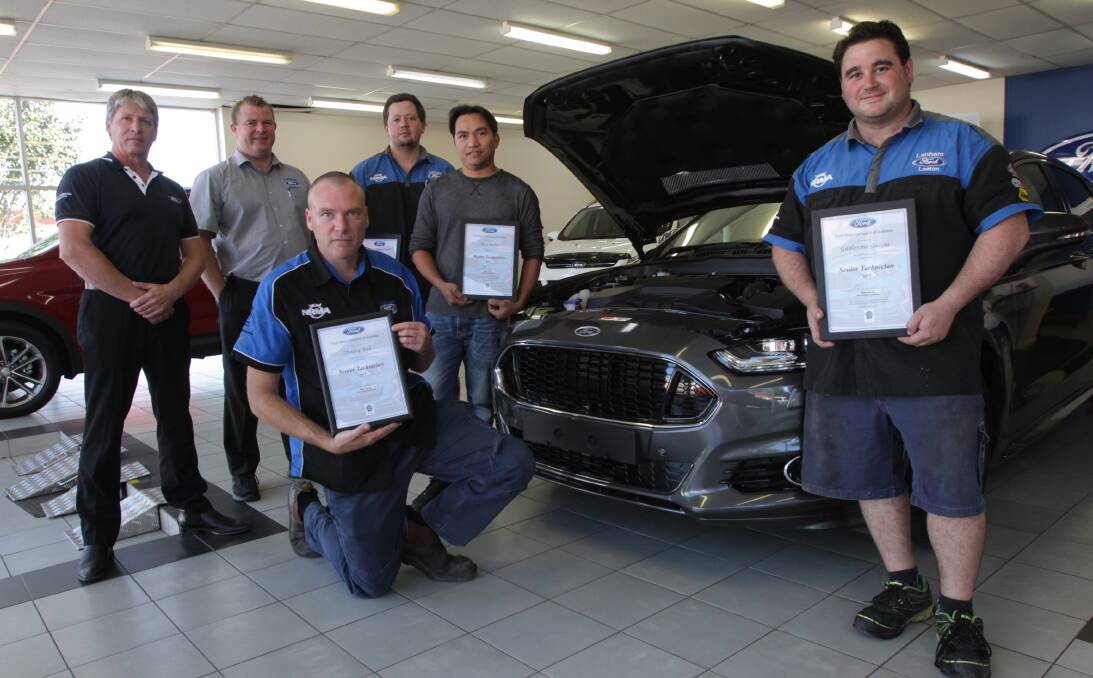 TOPS: Ford senior field service engineer Kevin Duffy, Stuart Lanham, new master technicians Steve Campbell and Alex Quino, (front) new senior technicians Ashley Bull and Will Garcia following the presentation in Leeton. 