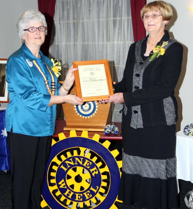 HANDOVER: Outgoing president Phyllis Guthrie (left) welcomes incoming president Lorraine McKellar to the role at the recent changeover dinner. 