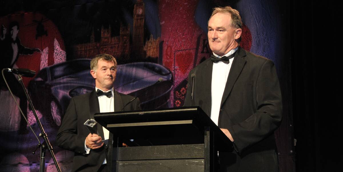 HONOUR: Roger (left) and Tim Commins accept the award for high achiever of the year at the Australian Cotton Industry Awards on the Gold Coast last week. Photo: Contributed