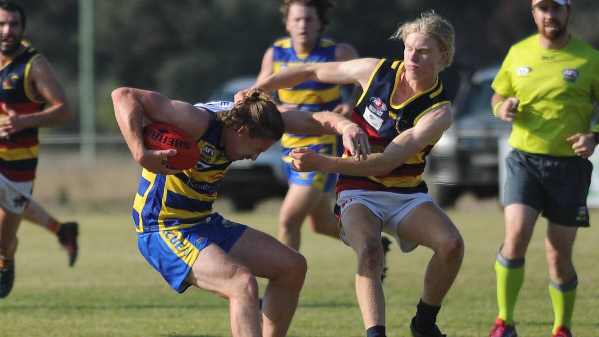 WRAP HIM UP: Leeton-Whitton's Ryan Dunn goes in for a tackle against the Goannas, but was likely penalised in the process for it being too high. 