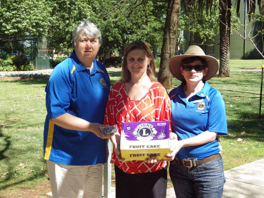 HELPING OUT: Tanya Lewis from Pinnacle Community Services (middle) receives a donation of Lions Cake slices from Leeton vice president Jackie Strempel (left) and member Katie McCavanough. The slices will be used by Meals On Wheels at Christmas. Photo: Contributed 
