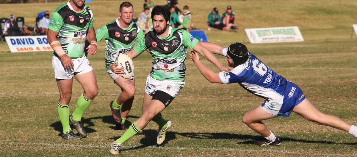 BREAKING THROUGH: Leeton's Brayden Scarr attempts to break the line as he continued his good form on Sunday, picking up a try against Yenda. Photo: Anthony Stipo