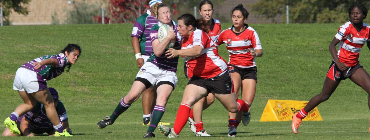 CRASH: Aimee Spowart can't avoid her CSU opponent during the Dianas' last home game. The side will return to No. 1 Oval this weekend where they will take on Albury. Photo: Ron Arel 