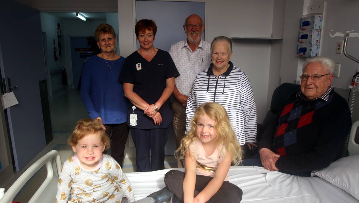 TOP EFFORT: Jenny Ciavarella, LeeAnne Driscoll, Brian King, Ros Swenser, Des Driscoll and (front) Imogen Lashbrook, 2, and Pippa Lashbrook, 5, with one the new beds. 
