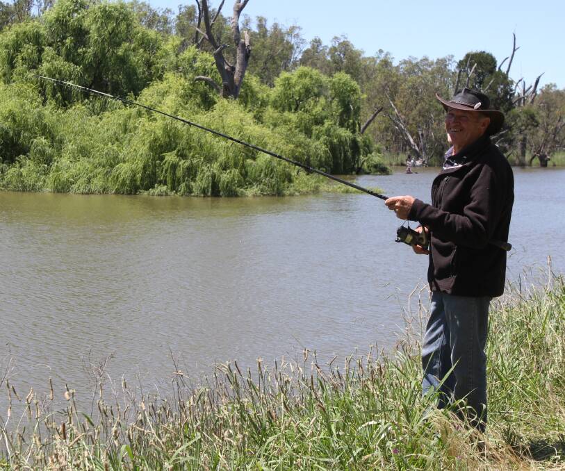 TIME OUT: Ken Hodges drops in a line at Gogeldrie Weir. A new management plan for the Leeton shire facility is now in place. 