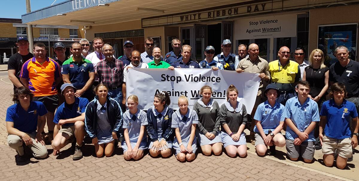 UNITED: Leeton shire men of many different backgrounds and students from Yanco Agricultural High School and St Francis College make their feelings known on domestic violence during White Ribbon Day. 