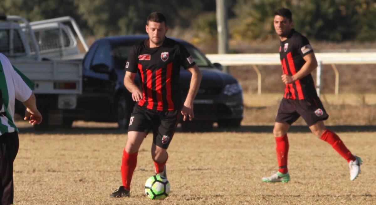 TIME IS NOW: Leeton United's Rhys Jones in action during an earlier game this season. The club will head to Tumut on Sunday and are desperate for a win. Photo: Talia Pattison 