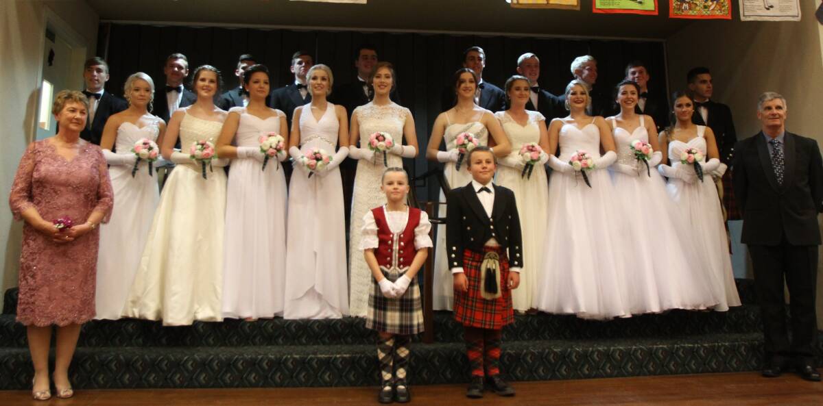 ALL SMILES: The debutantes and their partners at last year’s Scottish Debutante Ball in Leeton. Photo: Briana Bryon 