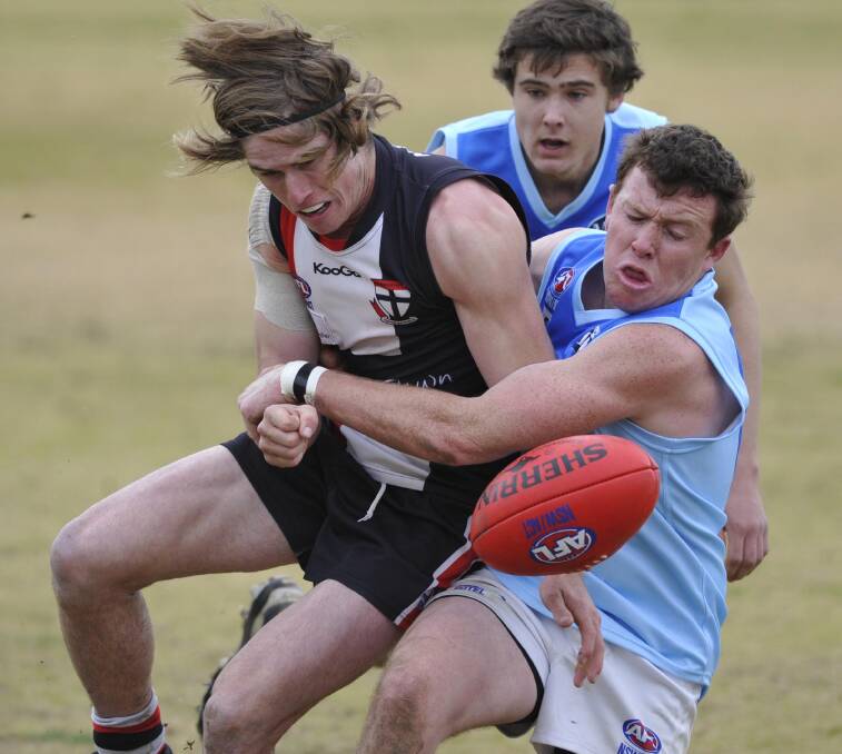 CRUNCH: Barellan's Jeff Phillpot brings down North Wagga's Corey Watt during a match last month. The Two Blues were unable to hold out Temora on Saturday.