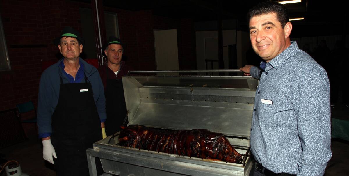 TASTY: Vince Zappaca, Ralph Fonte and Italian Catholic Committee president Dom Amato prepare some of the food for the salami night on Saturday. Photo: Ron Arel 