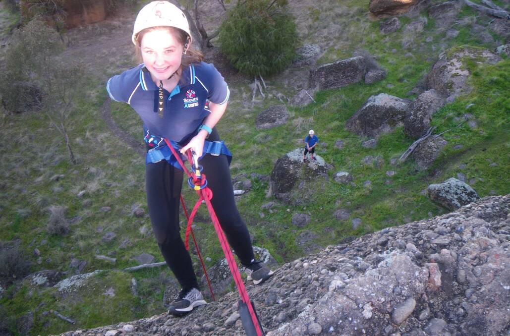 WOW: Leeton Scouts patrol leader Savannah Lloyd prepares to to abseil down a 15-metre cliff at Scenic Hill recently. Photo: Contributed