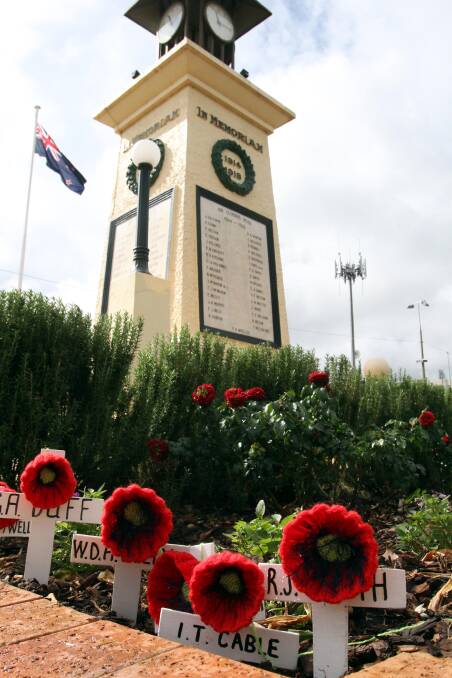 FITTING TRIBUTE: Names of Leeton's fallen from World War I and World War II line the cenotaph in Pine Avenue. 