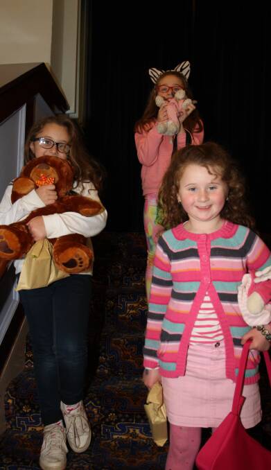 MOVIE TIME: Makenzie, 7, and Jorgia Shute, 5, and Heidi Arel prepare to head in to the theatre party fundraiser on Sunday. Photo: Ron Arel 