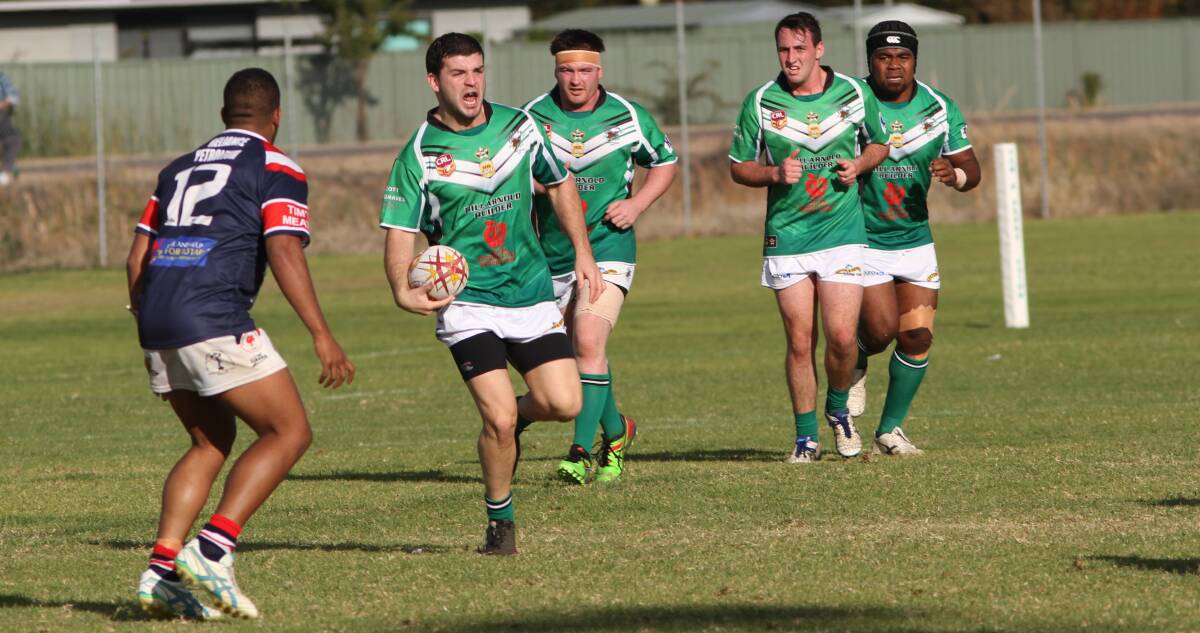 SEARCHING: Greens player Kieran Doran looks to offload this pass during a recent match at No. 1 Oval against Darlington Point Coleambally. Leeton will take on TLU at home on Sunday.