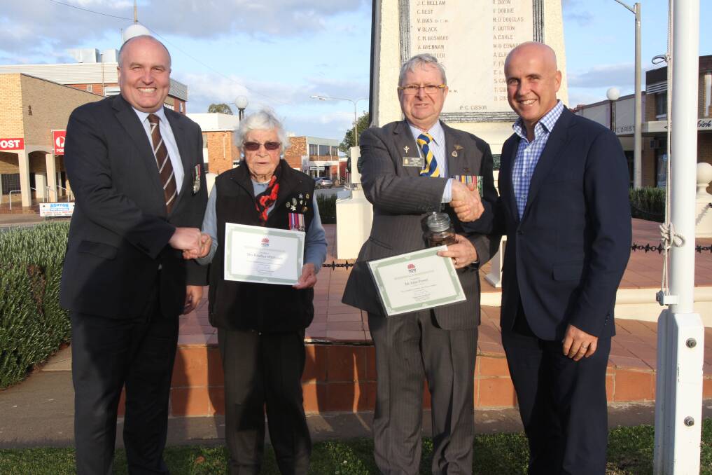 HONOUR: Minister for Veteran Affairs David Elliott and Member for Murray Adrian Piccoli congratulate Heather Whittaker and John Power on their awards. Photo: Talia Pattison