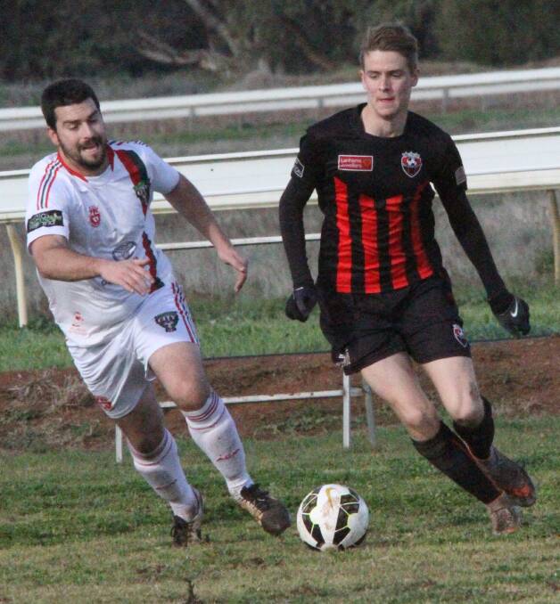 PUSH: Tory Amato gets the ball moving for Leeton United in their 5-0 win over Griffith City at MIA Sportsground last Sunday. 
