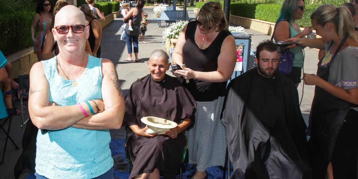 TEAM EFFORT: Debbie Smith watches on as others have their head shave to show support for her cancer battle and raise funds for Can Assist. Photo: Ron Arel