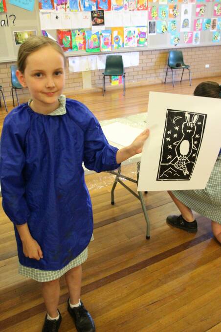 CREATIVE: Parkview Public School year 6 student Lilly Davies with one of her prints created during the workshops. Photo: Contributed 