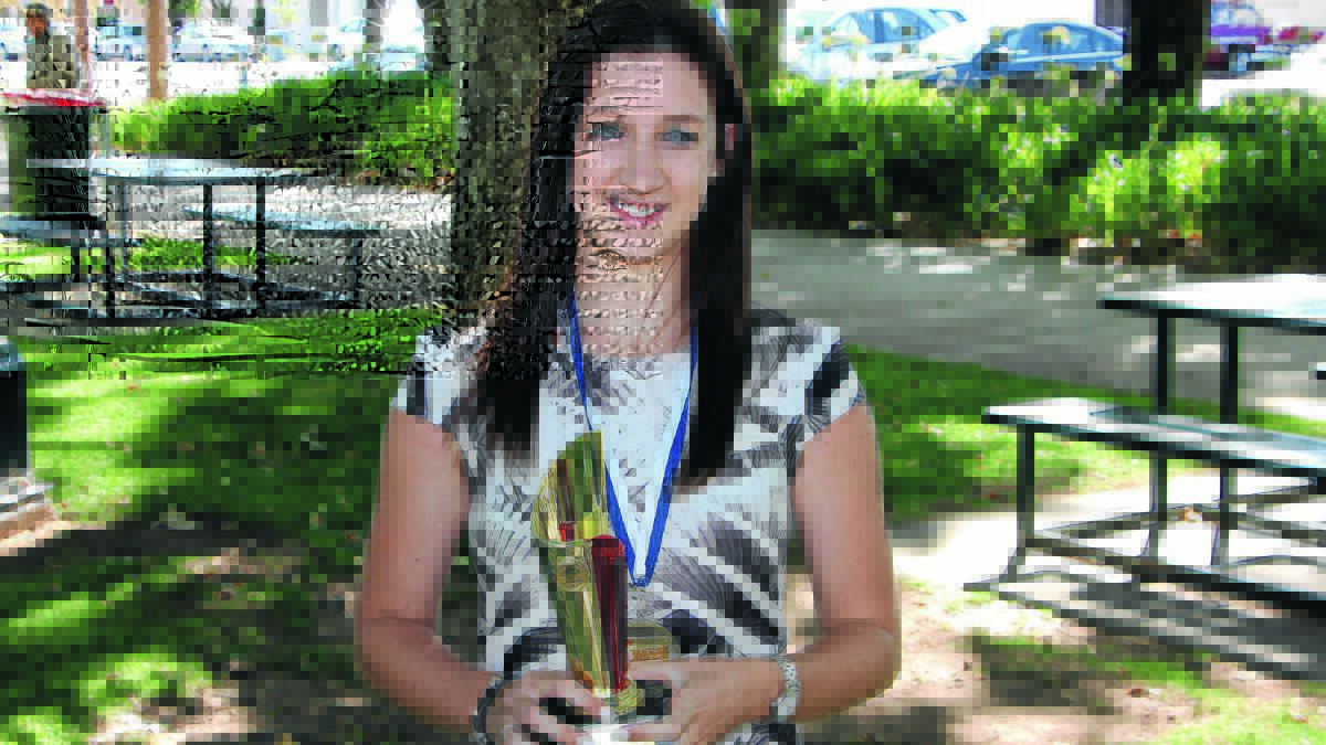 ALL SMILES: Leeton's Claire Quinlivan was named as this year's junior sportsperson of the year during the official Australia Day ceremony. 