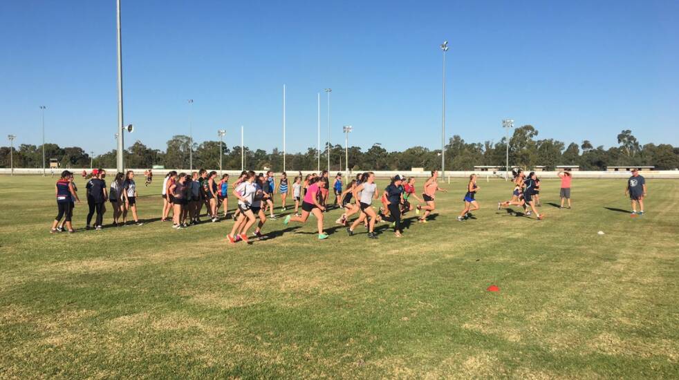 RARING TO GO: Close to 50 girls turned out for the under 16s girls Aussie rules training last week. Photo: Contributed 
