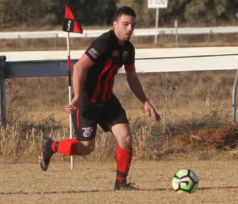 DRAWN MATCH: Leeton United's Adam Raso moves the ball forward for his side during a recent match at the club's home turf. United drew nil-all with Cootamundra on Sunday.